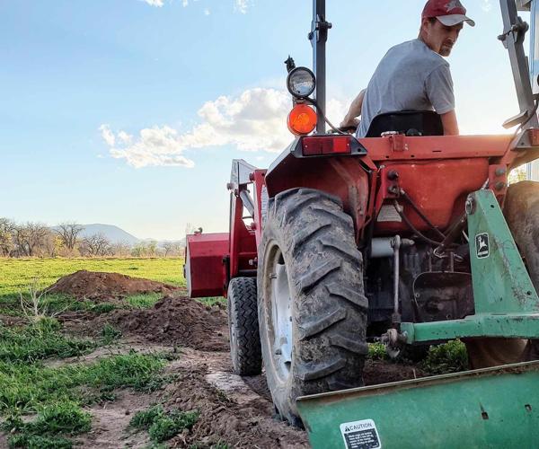 Mitchell hard at work on their family farm